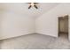 This bedroom features neutral walls, carpet, a ceiling fan and a window allowing natural light to fill the room at 20344 Heather Ln, Parker, CO 80138