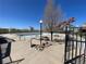 A nice place to relax at this Community Pool, complete with picnic tables, concrete and black metal fencing at 20344 Heather Ln, Parker, CO 80138