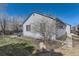 Exterior view of home featuring stone landscaping, well-maintained lawn, and light siding at 20344 Heather Ln, Parker, CO 80138