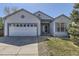 Charming single-Gathering home featuring a two-car garage, manicured lawn, and inviting entrance at 20344 Heather Ln, Parker, CO 80138