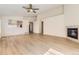 Open-concept living area with modern floors, a fireplace, and access to other rooms at 20344 Heather Ln, Parker, CO 80138
