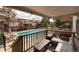 Relaxing balcony with views of the pool, seating, and surrounding neighborhood at 2700 S Holly St # 202, Denver, CO 80222