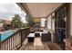 Inviting balcony with outdoor seating and a view of the community pool at 2700 S Holly St # 202, Denver, CO 80222