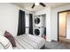 Bedroom with laundry area featuring a stacked washer and dryer for added convenience at 2700 S Holly St # 202, Denver, CO 80222