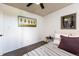 Cozy bedroom featuring neutral decor, modern artwork, and comfortable carpet at 2700 S Holly St # 202, Denver, CO 80222