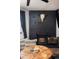 A rustic fireplace in the living room with a faux animal skull above at 2700 S Holly St # 202, Denver, CO 80222