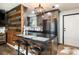 Charming kitchen featuring a black refrigerator, cabinets, countertops, and bar stool seating at 2700 S Holly St # 202, Denver, CO 80222