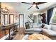 Inviting living room with comfortable seating, wood flooring, and staircase at 2700 S Holly St # 202, Denver, CO 80222