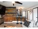 Bright living space featuring wood accents, a kitchen bar, and comfortable seating at 2700 S Holly St # 202, Denver, CO 80222