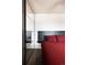 Comfortable bedroom with a spacious closet, a modern headboard and mirrored closet doors at 2700 S Holly St # 202, Denver, CO 80222