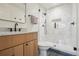 Updated bathroom featuring a glass shower, wood vanity, and black hardware at 632 Wyoming St, Golden, CO 80403