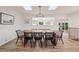 Dining room with modern chandelier, hardwood floors, and ample natural light at 632 Wyoming St, Golden, CO 80403