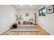 Bright foyer with hardwood floors, a bench, and a decorative rug at 632 Wyoming St, Golden, CO 80403