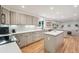 Updated kitchen with sleek countertops, modern cabinetry, and stainless steel appliances at 632 Wyoming St, Golden, CO 80403