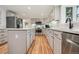 Updated kitchen features stainless steel appliances, light countertops, and hardwood floors at 632 Wyoming St, Golden, CO 80403