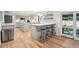 Modern kitchen featuring an island with bar seating, new appliances, and plenty of storage at 632 Wyoming St, Golden, CO 80403