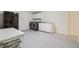 Spacious laundry room with modern washer, dryer, sink, and ample storage space at 632 Wyoming St, Golden, CO 80403