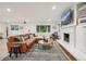 Cozy living room boasts hardwood floors, a stone fireplace, and large windows at 632 Wyoming St, Golden, CO 80403