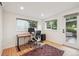 Bright office with hardwood floors, large windows, and a door to the backyard at 632 Wyoming St, Golden, CO 80403