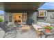 Charming covered patio with comfortable seating, grill, and access to the indoors at 632 Wyoming St, Golden, CO 80403