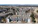 Aerial view of the community surrounded by mature trees and beautiful landscaping at 14495 E 1St Dr # C1, Aurora, CO 80011