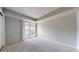 The bedroom has neutral carpet and a sliding glass door to a balcony at 14495 E 1St Dr # C1, Aurora, CO 80011