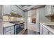 Modern kitchen providing a seamless view to the spacious living area with fireplace at 14495 E 1St Dr # C1, Aurora, CO 80011