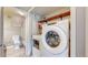 Laundry closet with washer and dryer plus extra shelving for storage at 14495 E 1St Dr # C1, Aurora, CO 80011
