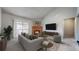 Inviting living room featuring a cozy fireplace, balcony access, and comfortable seating area at 14495 E 1St Dr # C1, Aurora, CO 80011