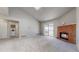 Spacious living area with fireplace, access to the balcony, and convenient washer/dryer closet at 14495 E 1St Dr # C1, Aurora, CO 80011