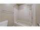 Shower over tub with white tile surround, shower head, and chrome fixtures at 14495 E 1St Dr # C1, Aurora, CO 80011