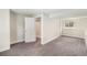 Finished basement with carpeting, closet, and a window bringing in natural light at 15908 E Flora Pl, Aurora, CO 80013