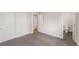 Comfortable bedroom with carpeting, closet space, and an adjacent bathroom at 15908 E Flora Pl, Aurora, CO 80013