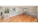 Inviting living area with hardwood floors connecting to the kitchen and a cozy outdoor deck at 15908 E Flora Pl, Aurora, CO 80013