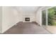 Cozy living area with fireplace and sliding door to an outdoor area at 15908 E Flora Pl, Aurora, CO 80013