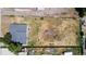 A bird's-eye view of an expansive lot with a home, offering ample space and potential at 5942 Poplar St, Commerce City, CO 80022