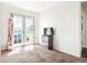 Bedroom with carpet flooring, double glass doors, and a view of the outdoors at 5942 Poplar St, Commerce City, CO 80022