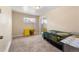 Bedroom featuring neutral walls, carpet flooring, and a mirror closet door at 5942 Poplar St, Commerce City, CO 80022