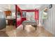 View of dining room with open access to kitchen, tile floors, and a window at 5942 Poplar St, Commerce City, CO 80022