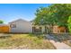Cozy home featuring a charming stone porch, quaint yard, and inviting walkway at 5942 Poplar St, Commerce City, CO 80022