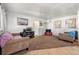 Bright living room featuring carpet flooring, neutral walls, and great natural light at 5942 Poplar St, Commerce City, CO 80022