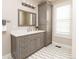 Beautiful bathroom features a modern vanity, stylish mirror, and chic gray color palette at 295 Jersey St, Denver, CO 80220