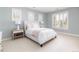 Bright and airy bedroom with neutral colors and shuttered windows at 295 Jersey St, Denver, CO 80220