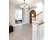 Inviting foyer with hardwood floors, chandelier, and arched doorway at 295 Jersey St, Denver, CO 80220