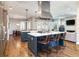 Spacious kitchen with a center island, stainless steel hood, and hardwood floors at 295 Jersey St, Denver, CO 80220