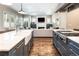 Open-concept kitchen features granite countertops, stainless appliances, and seamless living room access at 295 Jersey St, Denver, CO 80220