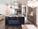 Spacious kitchen boasts modern stainless steel appliances and a large island with seating at 295 Jersey St, Denver, CO 80220
