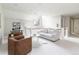 Cozy living room with lots of natural light from the window and white paint at 295 Jersey St, Denver, CO 80220