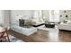 Bright living room featuring a modern fireplace and an archway to the dining room at 295 Jersey St, Denver, CO 80220