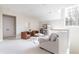 Bright living room featuring white walls, neutral furniture, and an inviting atmosphere at 295 Jersey St, Denver, CO 80220